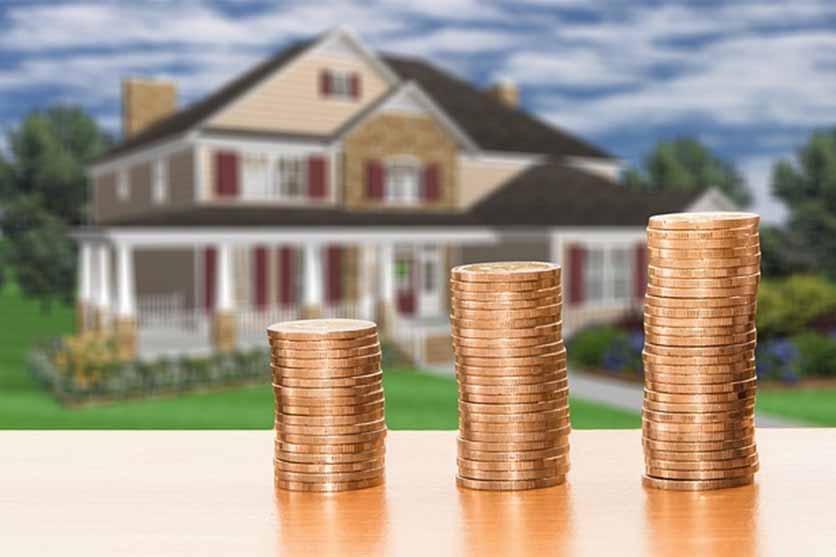 House and stacks of coins